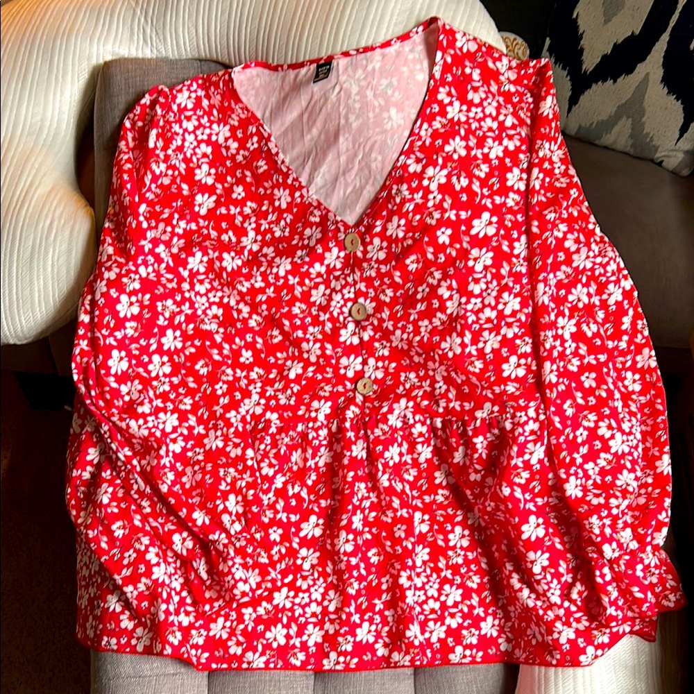 Red long sleeve shirt with white flowers